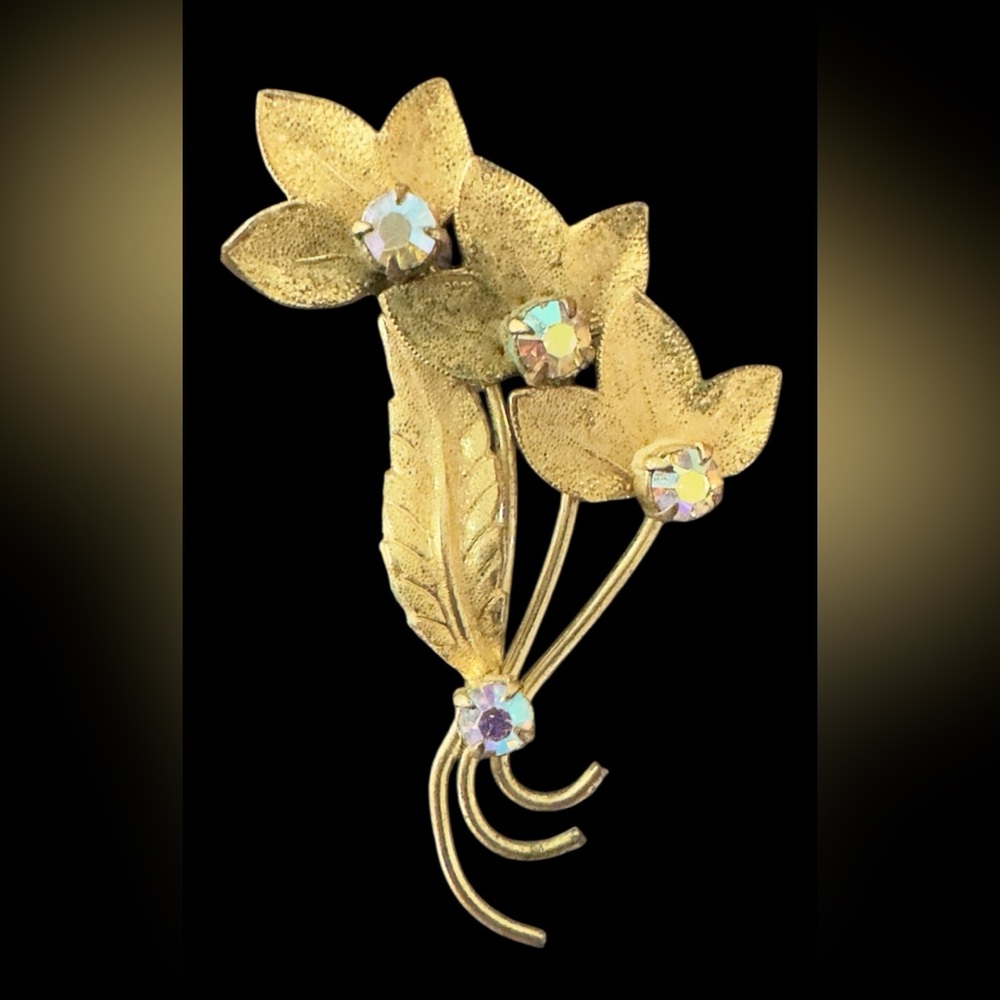 Elegant Gold Floral Brooch with Gem Accents